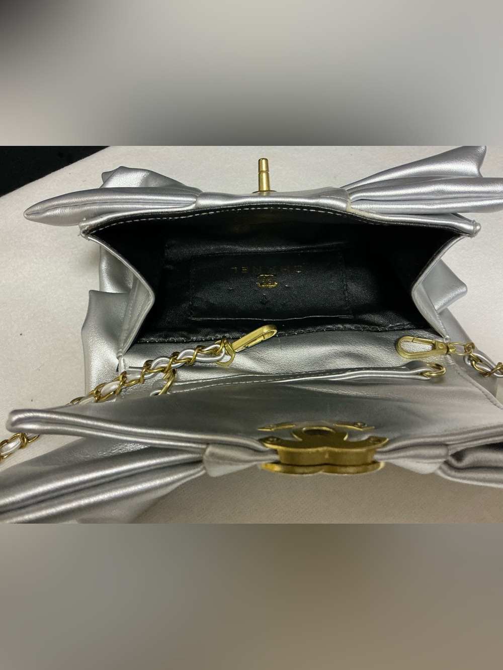 Silver Satin Bow Clutch with Gold Emblem - Picture 7 of 8